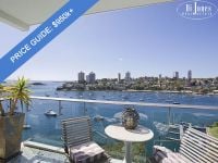 PRICE GUIDE $950k+ Luxurious harbourside haven with rare dual aspect harbour views.