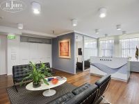 Versatile commercial/residential warehouse space.