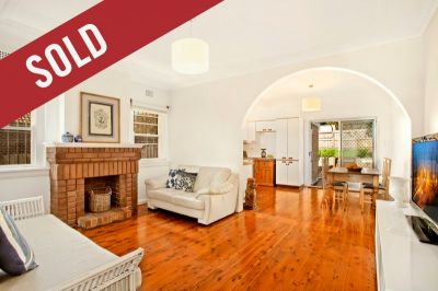 Charming, updated semi with ocean views, garaging and loads of potential.