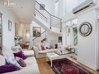Sophisticated bayside home - footsteps to the beach.