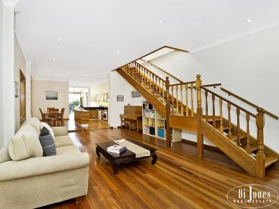 Wide-fronted 2 level semi with spacious open living areas.