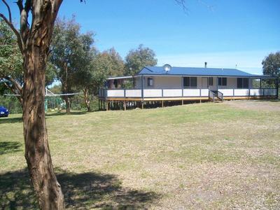 Contemporary Country Charm on just under 3 acres plus only minutes to the beach.