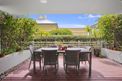 Light & spacious two-level retreat in prime waterside setting