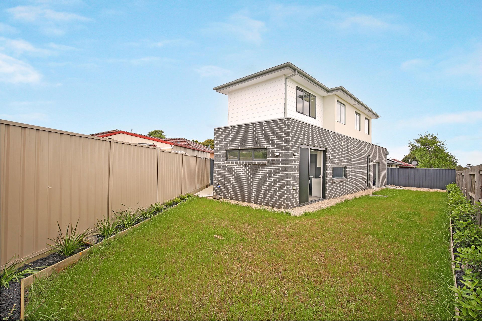 Chic and Modern Family Living Awaits in This Newly Built Family Home!