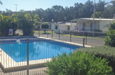 CABIN & CARAVAN PARK FOR SALE - CENTRAL COAST - ADJACENT LAKE