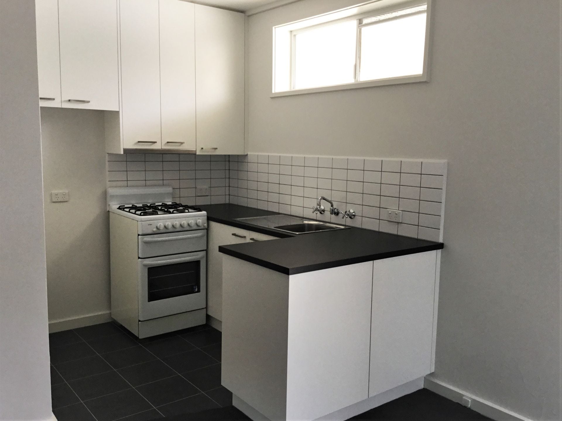 RENOVATED APARTMENT STEPS FROM HIGH STREET