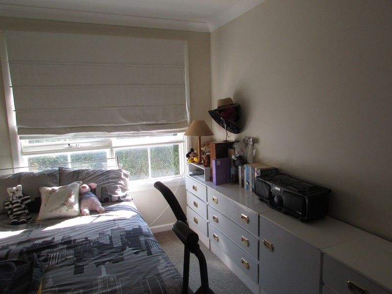 **Located in lovely tree-lined street**