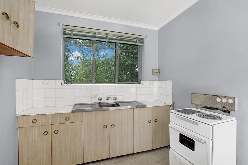 SOLD - Potential-Packed Top Floor Apartment with City Views