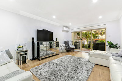 ELEGANT AND IMMACULATELY PRESENTED IN RESORT STYLE COMPLEX  