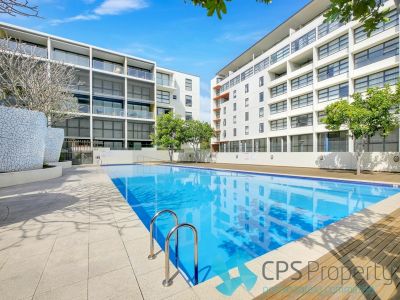 STYLISH TOP FLOOR RESIDENCE IN RESORT STYLE SECURITY COMPLEX