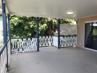 Breezy upstairs unit with large entertainment area