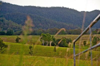 5 stunning acres within minutes of Samford Village. A very rare find.