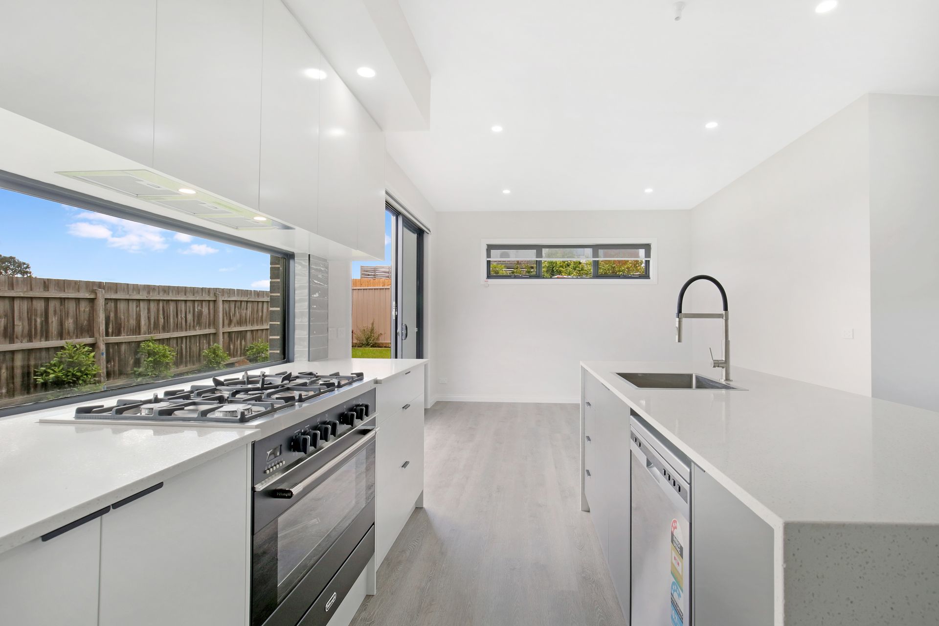 Chic and Modern Family Living Awaits in This Newly Built Family Home!