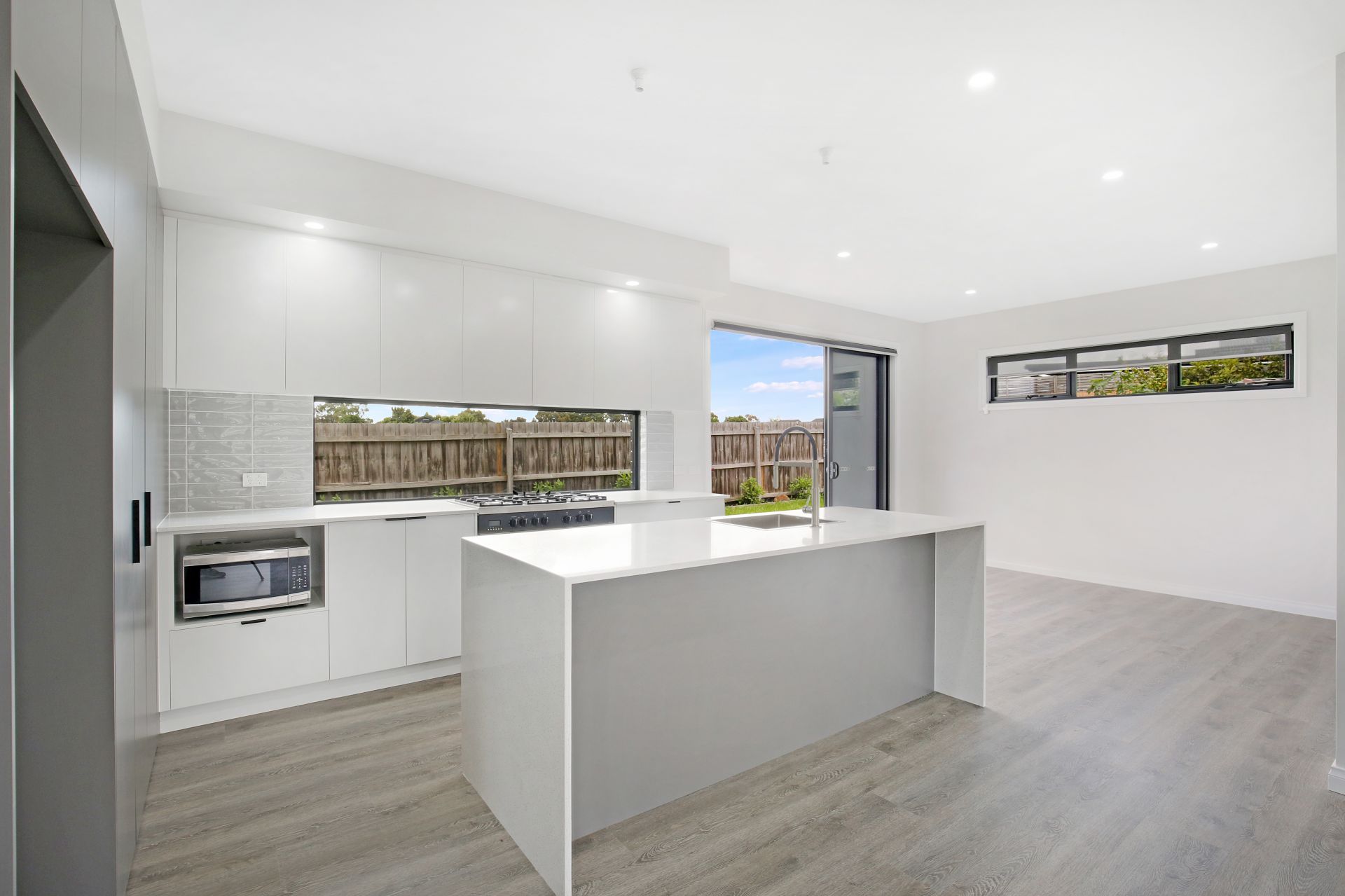 Chic and Modern Family Living Awaits in This Newly Built Family Home!