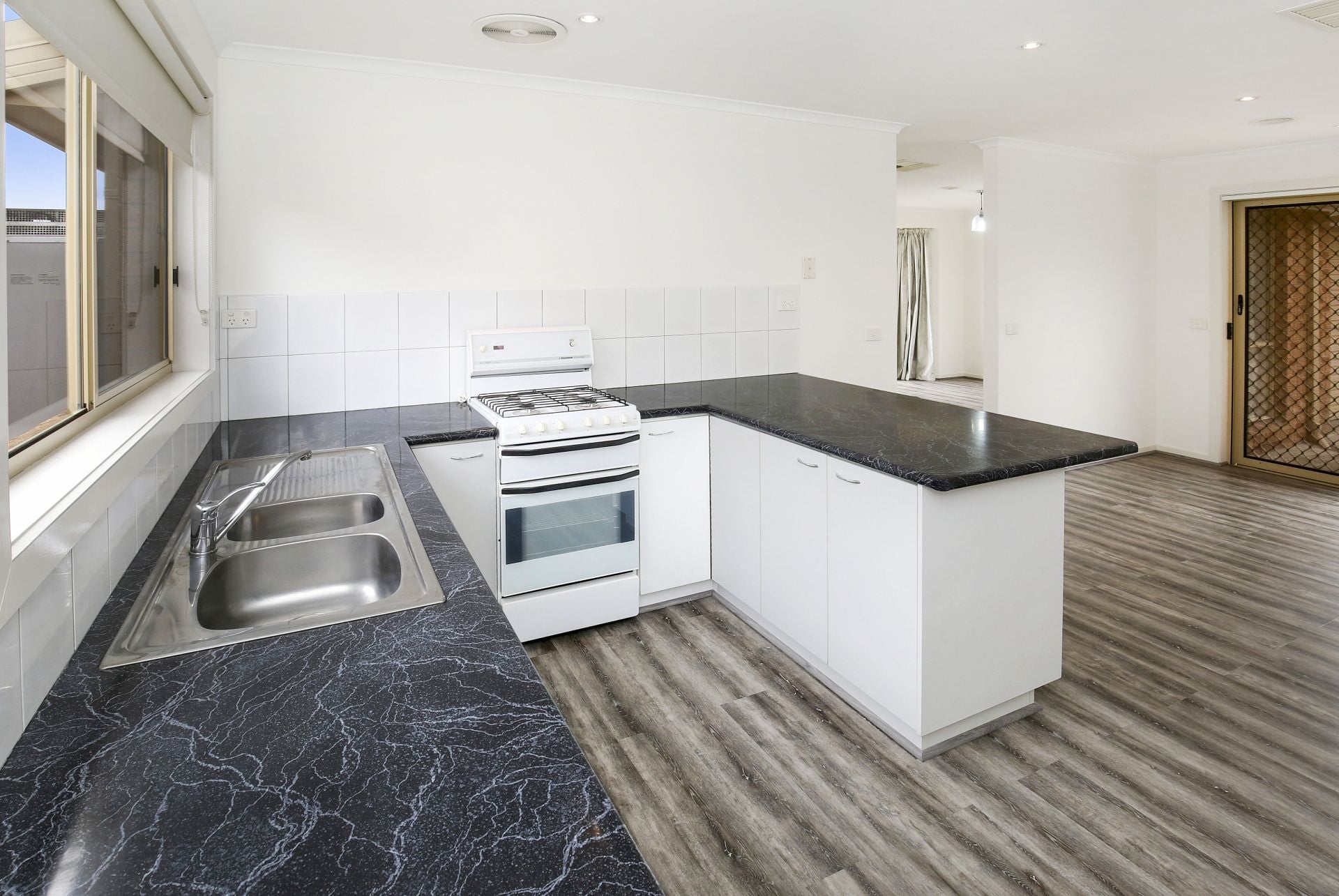 COMFORTABLE, CONVENIENT AND A GENEROUS BACKYARD