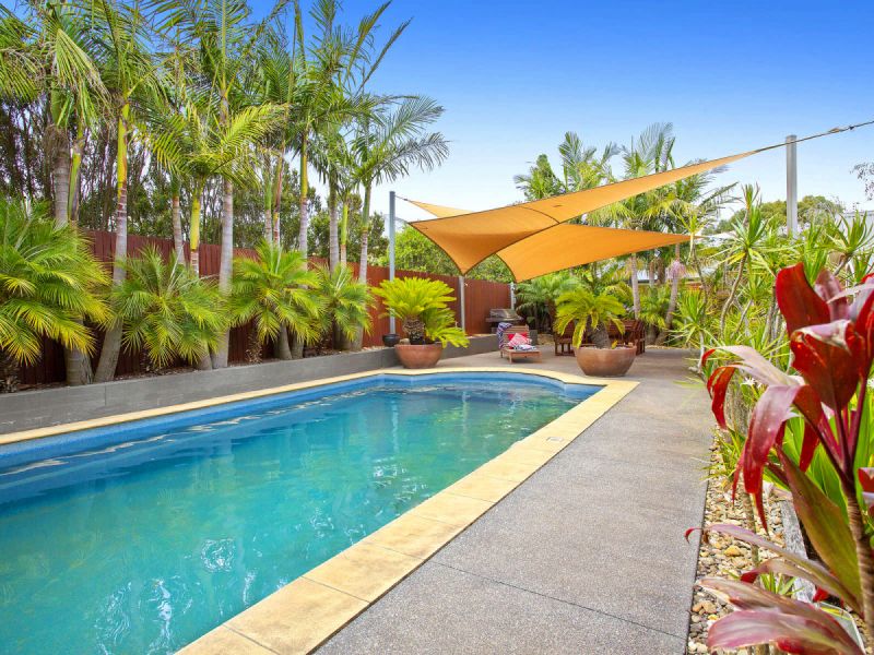 Beachside tropical oasis set on 1413m2 with features galore and the beach, park, school and store just around the corner.